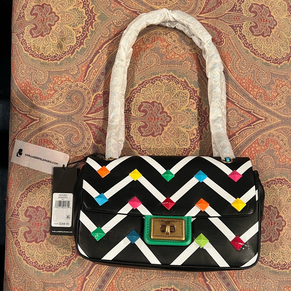 Karl Lagerfeld purse, gems on the front with gold, chained straps with gems.